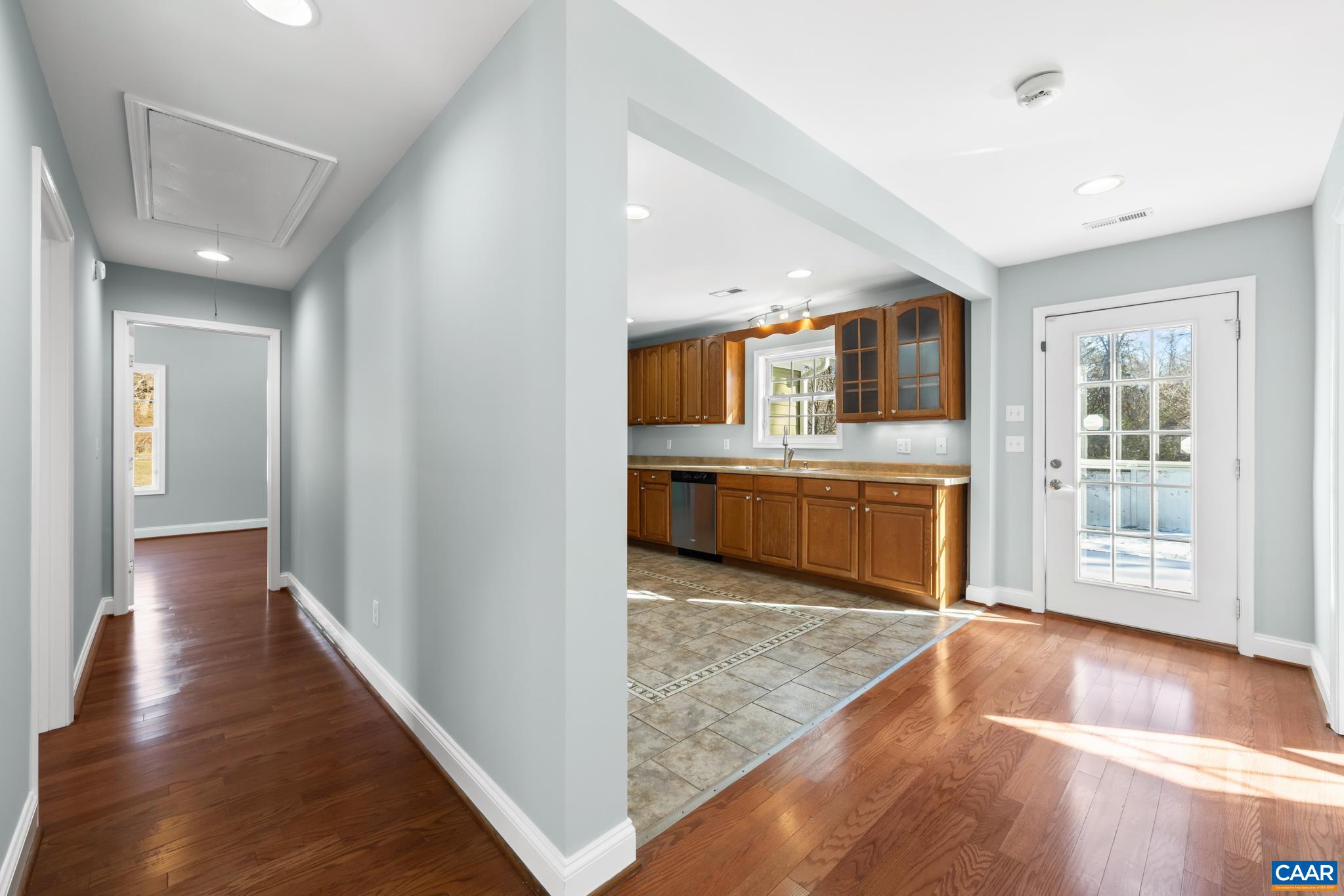 703 Tilman Road Charlottesville, VA 22901 - Photo 11 of 37 a view of a kitchen with wooden floor and a window