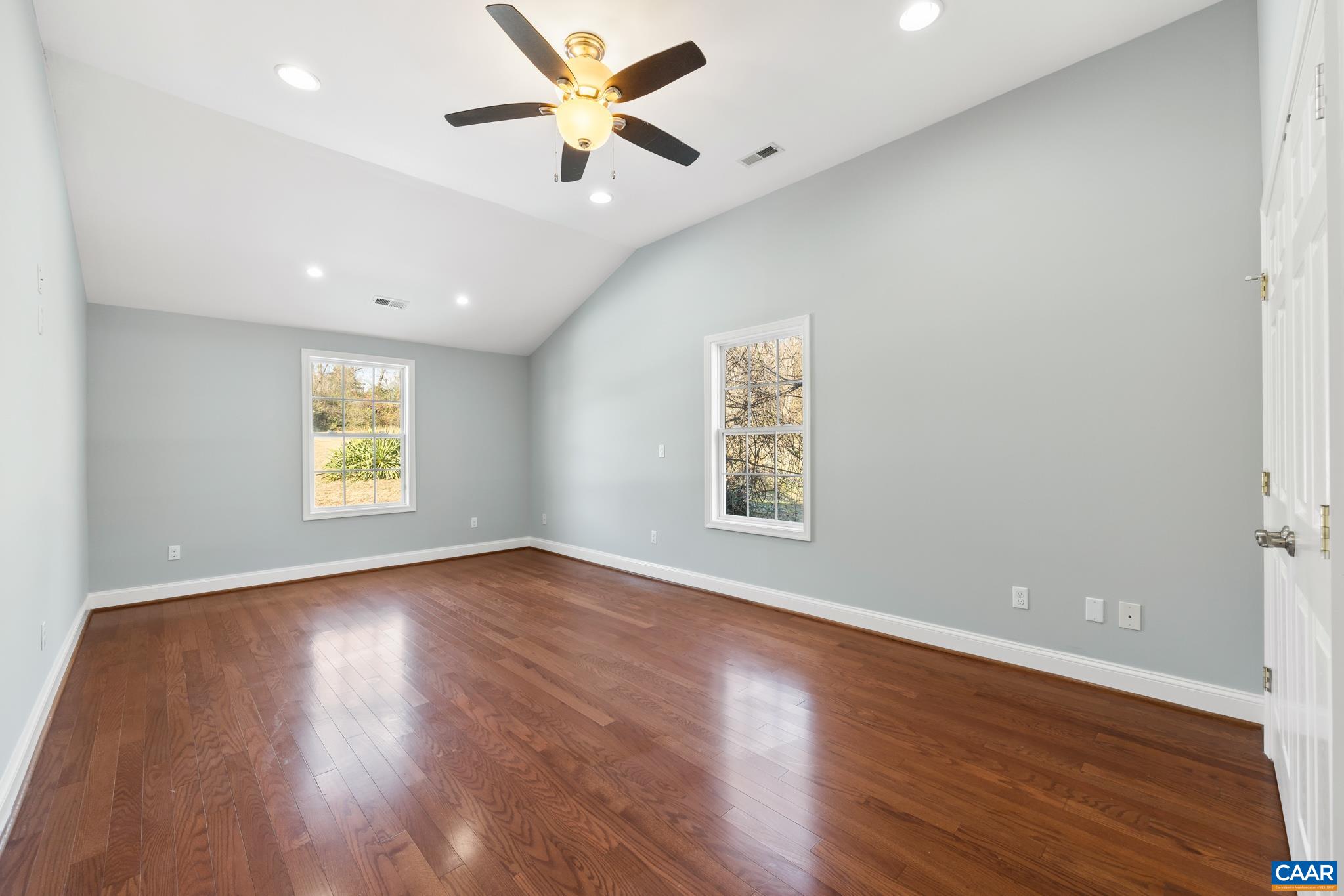 703 Tilman Road Charlottesville, VA 22901 - Photo 20 of 37 wooden floor in an empty room with a window