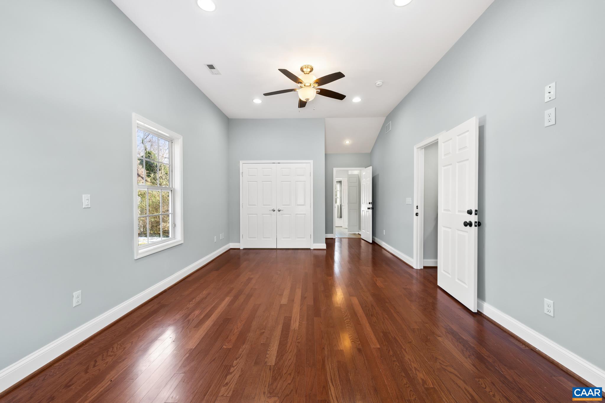 703 Tilman Road Charlottesville, VA 22901 - Photo 21 of 37 a view of an empty room with window and wooden floor