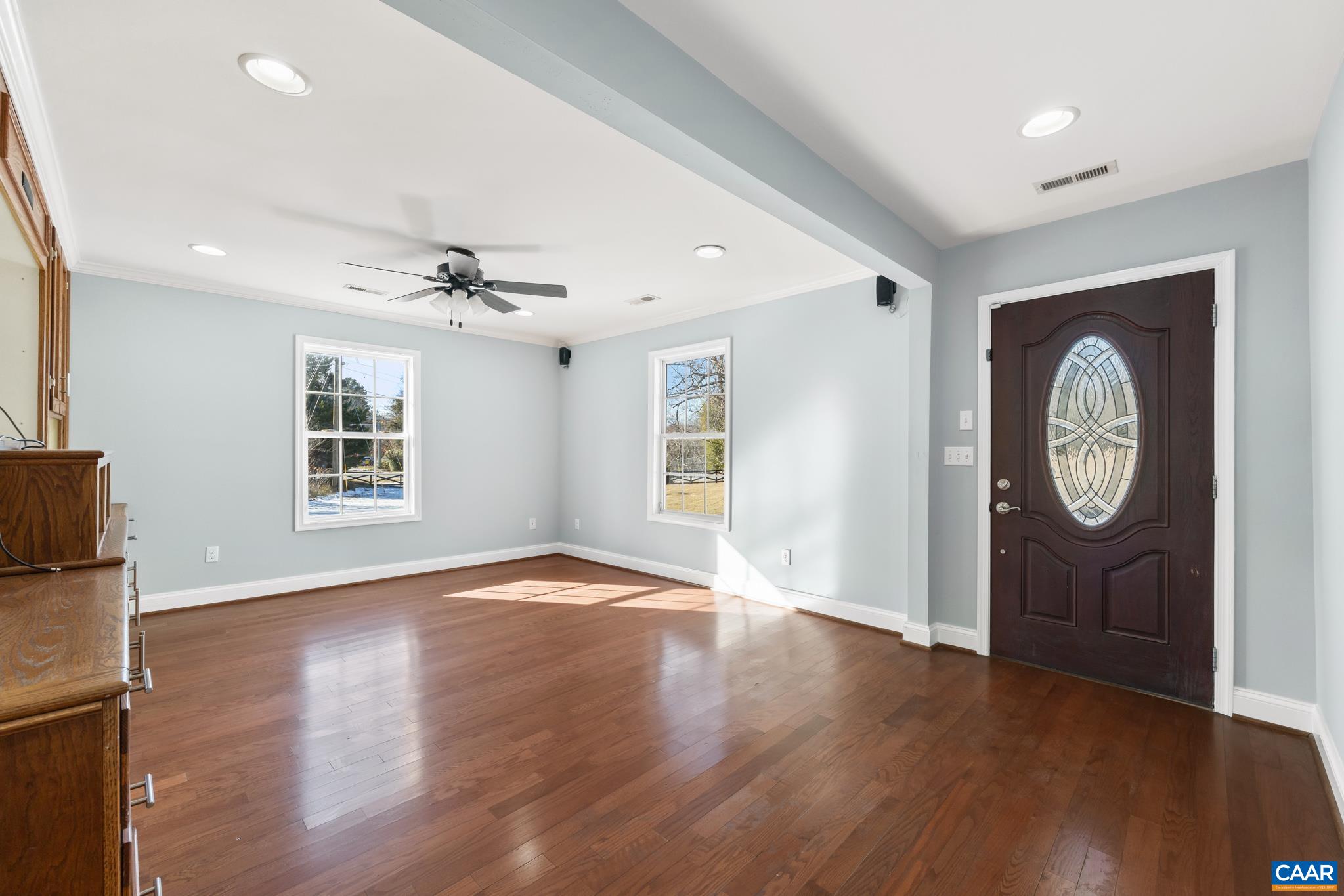 703 Tilman Road Charlottesville, VA 22901 - Photo 10 of 37 a view of an empty room with wooden floor and a window