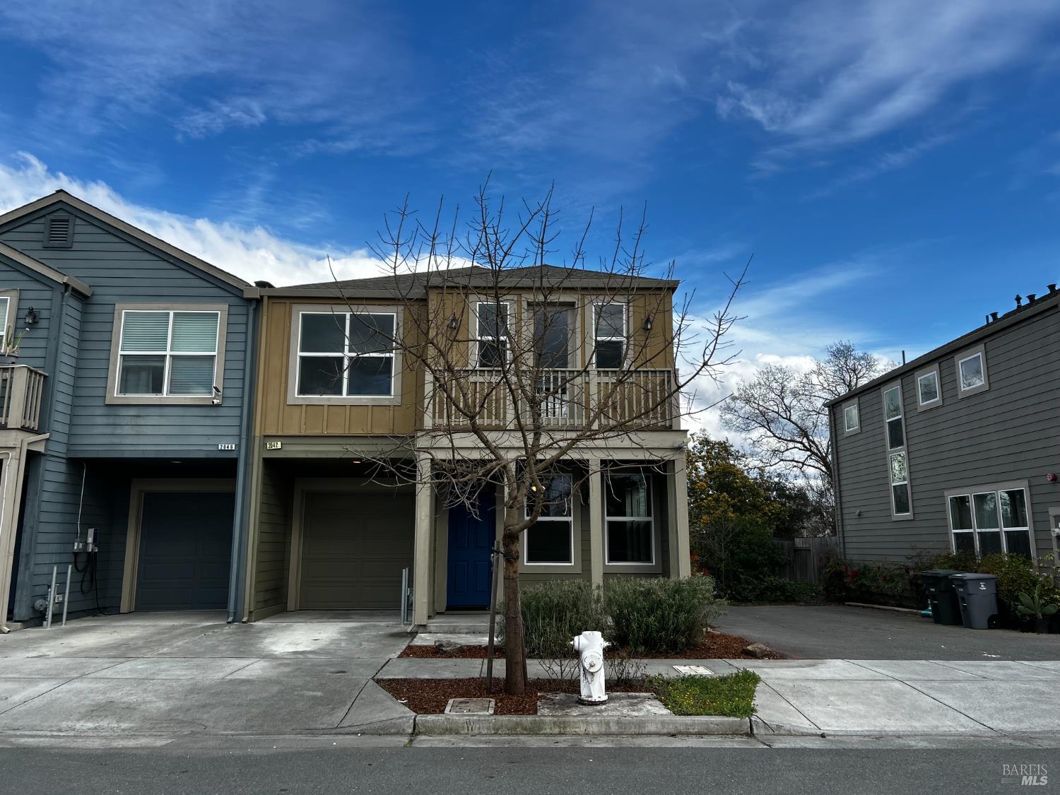 a front view of a house with garage