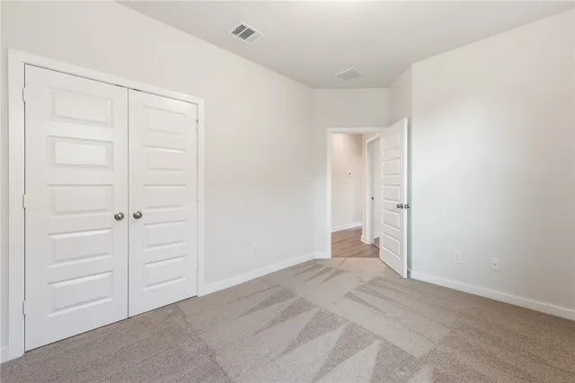 a view of a room with an empty space