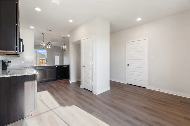 a view of kitchen with wooden floor