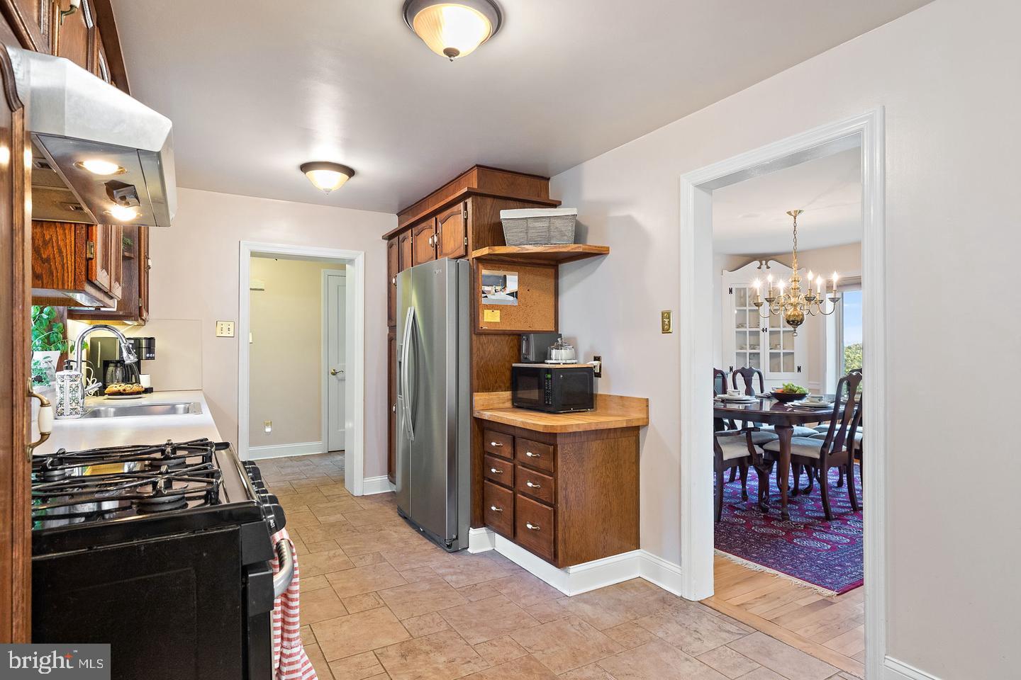 181 East Conestoga Road Wayne, PA 19087 - Photo 15 of 34 a kitchen with stainless steel appliances granite countertop a stove and a refrigerator