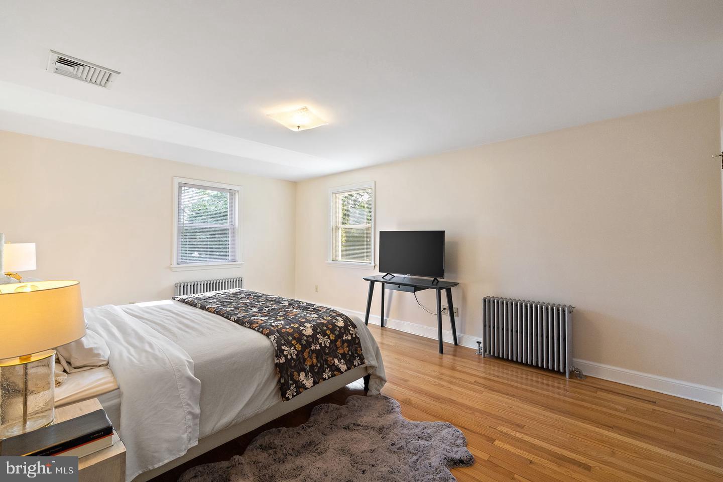 181 East Conestoga Road Wayne, PA 19087 - Photo 25 of 34 a bedroom with a bed and a flat screen tv