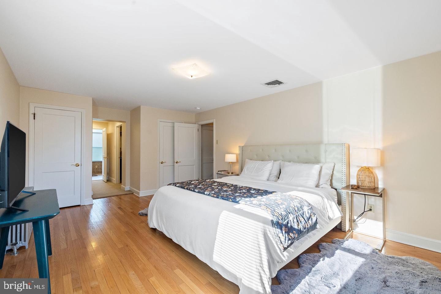 181 East Conestoga Road Wayne, PA 19087 - Photo 26 of 34 a bedroom with a bed and a flat screen tv