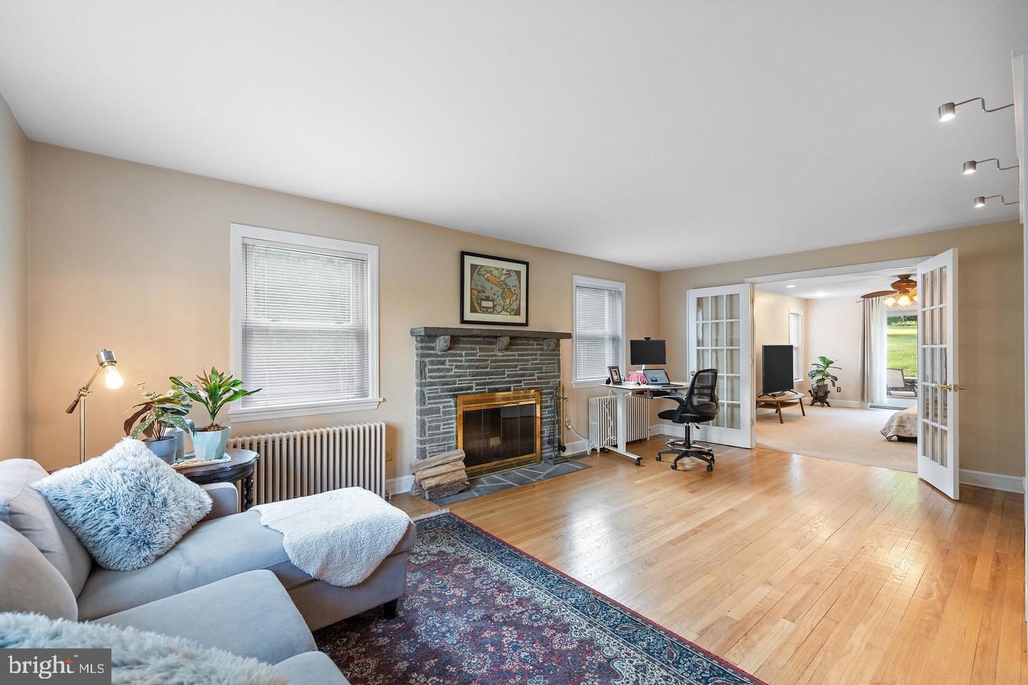 181 East Conestoga Road Wayne, PA 19087 - Photo 6 of 34 a living room with furniture and a fireplace