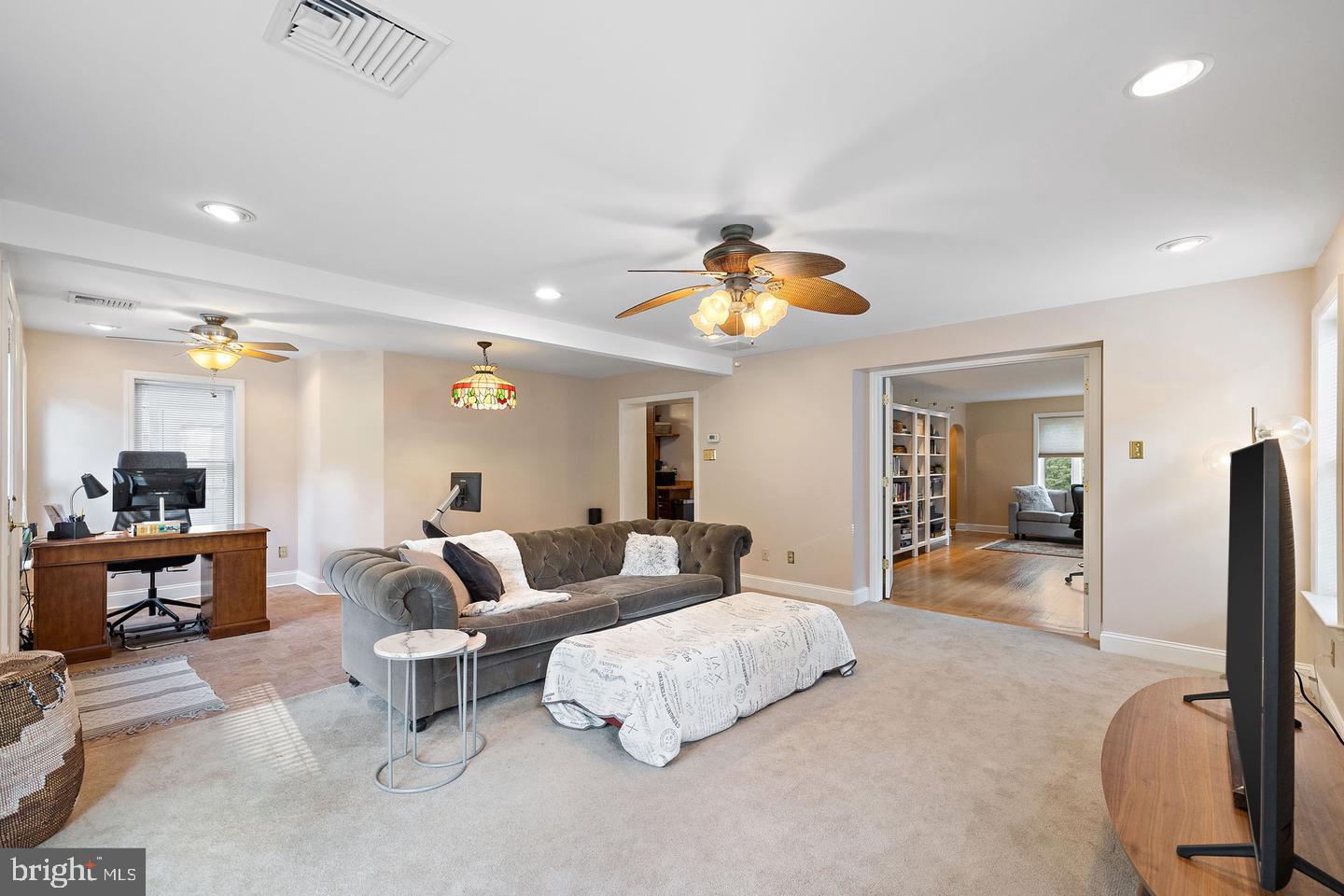 181 East Conestoga Road Wayne, PA 19087 - Photo 10 of 34 a living room with furniture and a chandelier