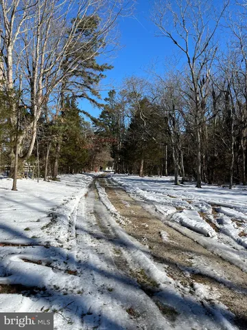 a view of snow on the side of the road