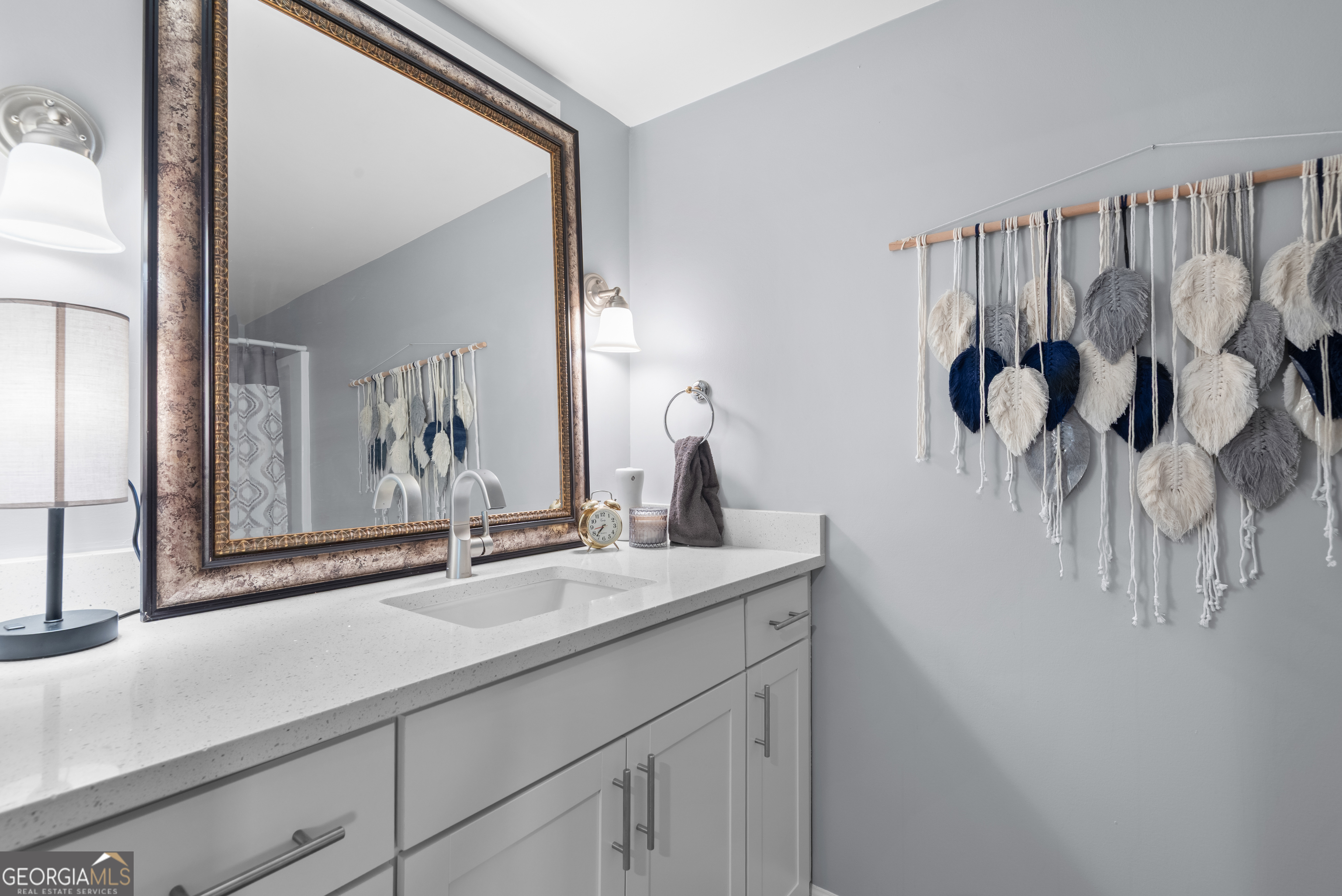 180 Southern Shores Road Jackson, GA 30233 - Photo 14 of 40 a bathroom with a sink and a mirror