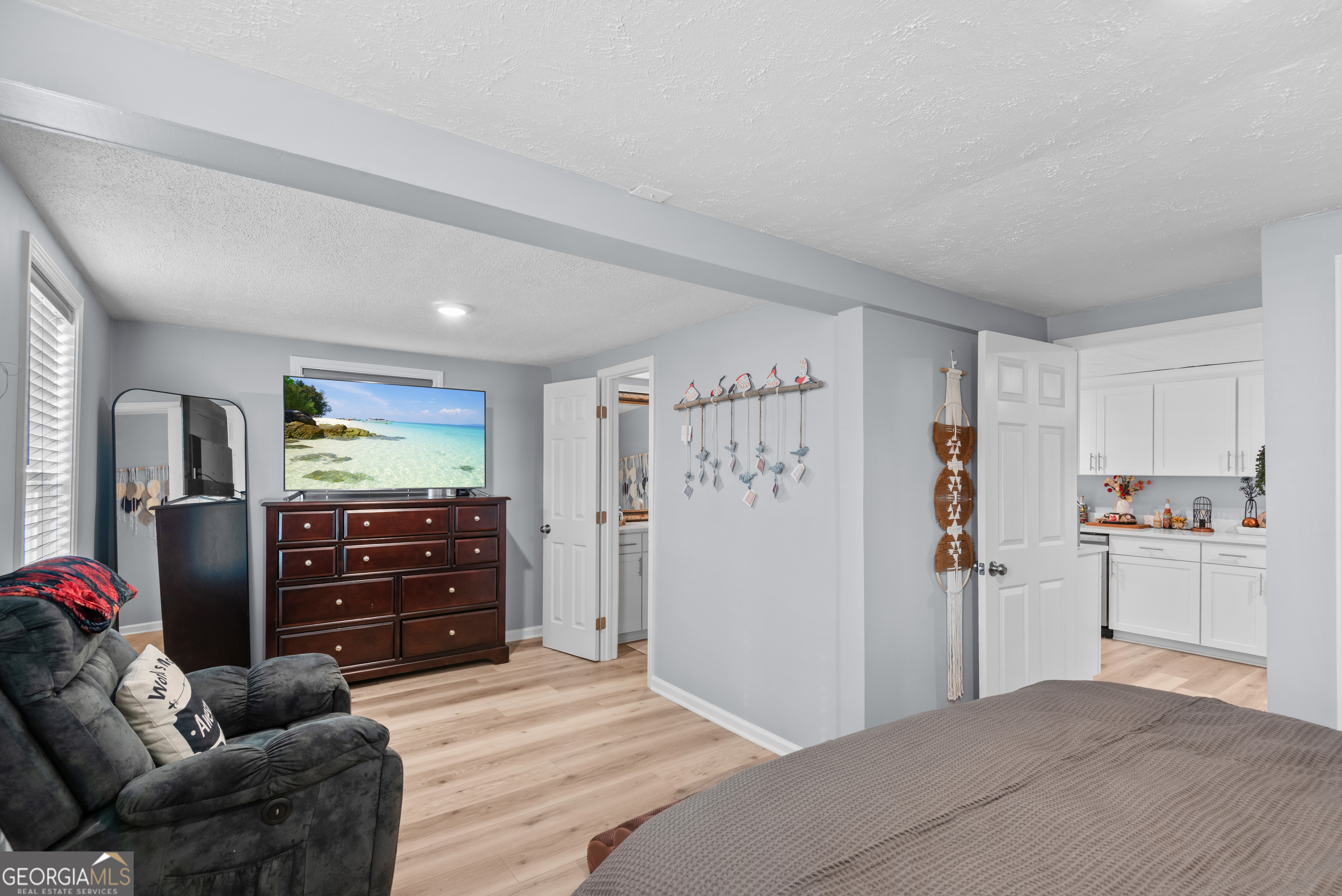 180 Southern Shores Road Jackson, GA 30233 - Photo 17 of 40 a room with a bed and a dresser
