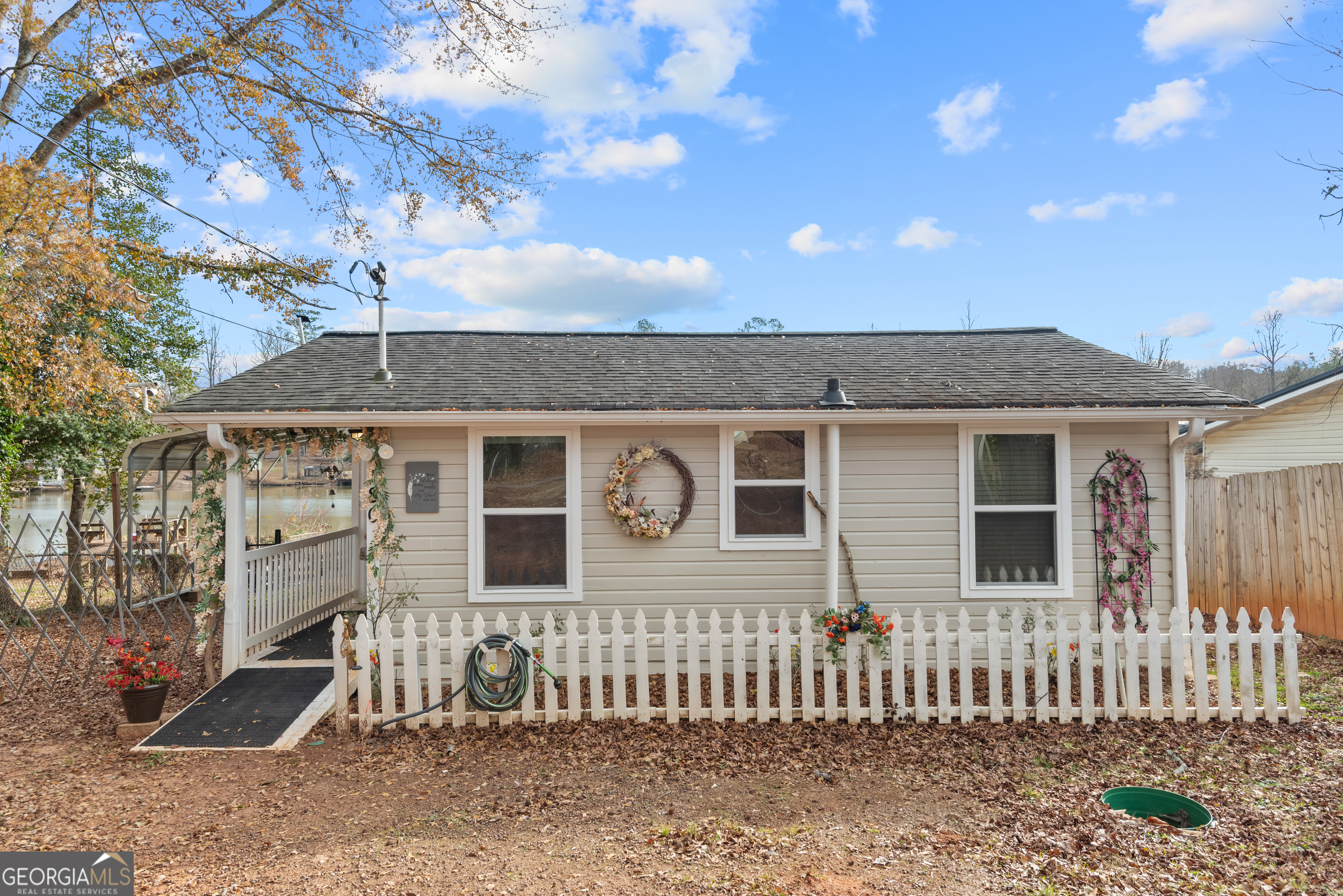 180 Southern Shores Road Jackson, GA 30233 - Photo 2 of 40 a front view of a house with a porch