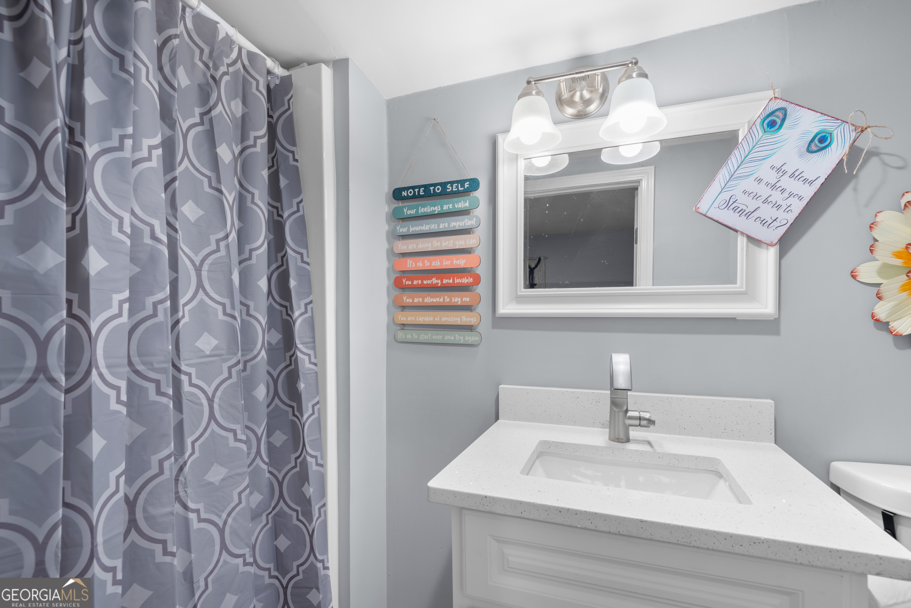 180 Southern Shores Road Jackson, GA 30233 - Photo 24 of 40 a bathroom with a sink and a mirror