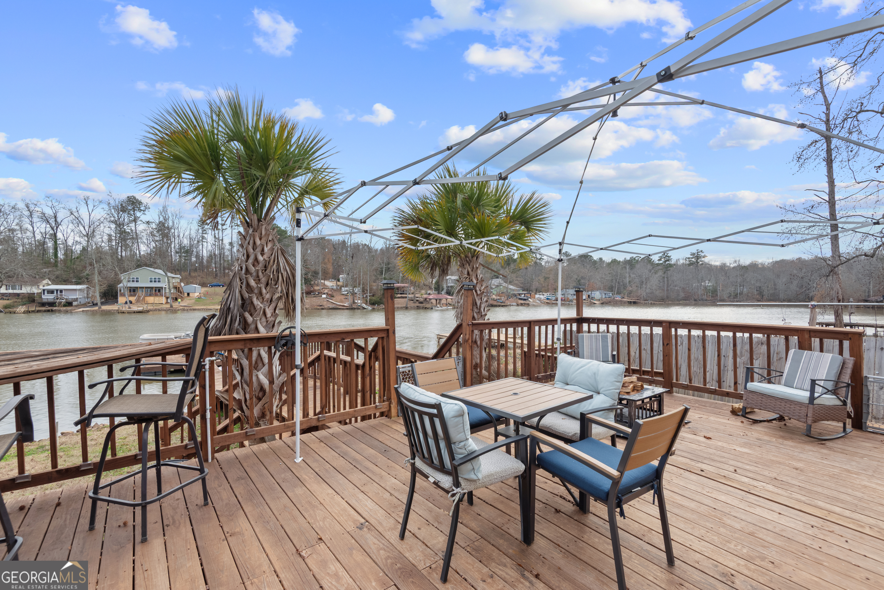 180 Southern Shores Road Jackson, GA 30233 - Photo 26 of 40 a view of a chairs and table on the deck