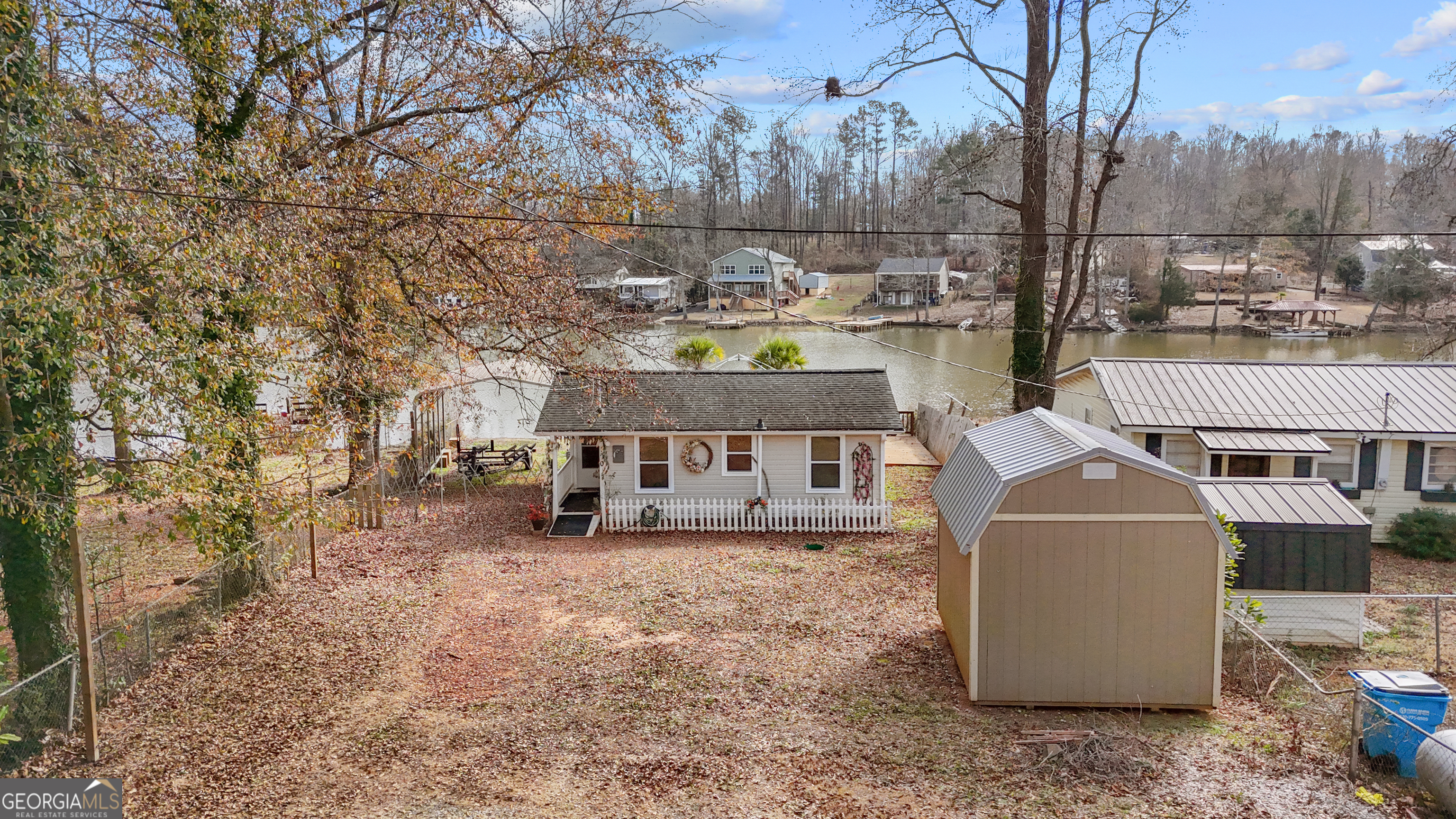 180 Southern Shores Road Jackson, GA 30233 - Photo 29 of 40 a view of a house with a yard covered in snow
