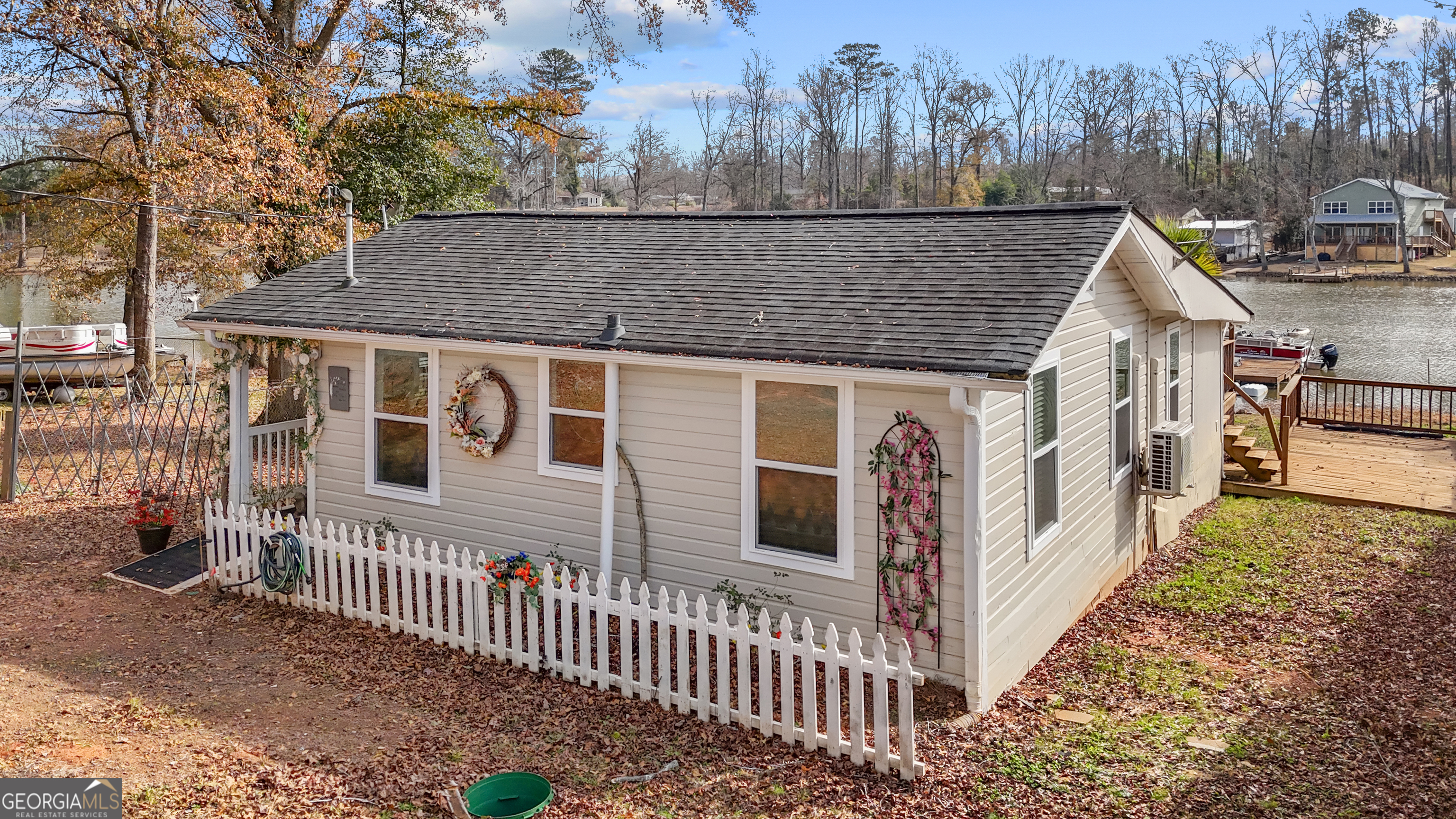 180 Southern Shores Road Jackson, GA 30233 - Photo 30 of 40 a view of a house with wooden fence