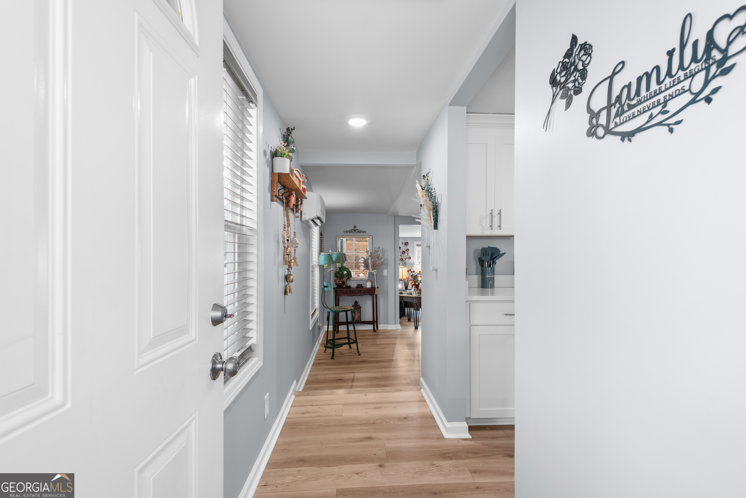 180 Southern Shores Road Jackson, GA 30233 - Photo 5 of 40 a view of a hallway with wooden floor and a bathroom