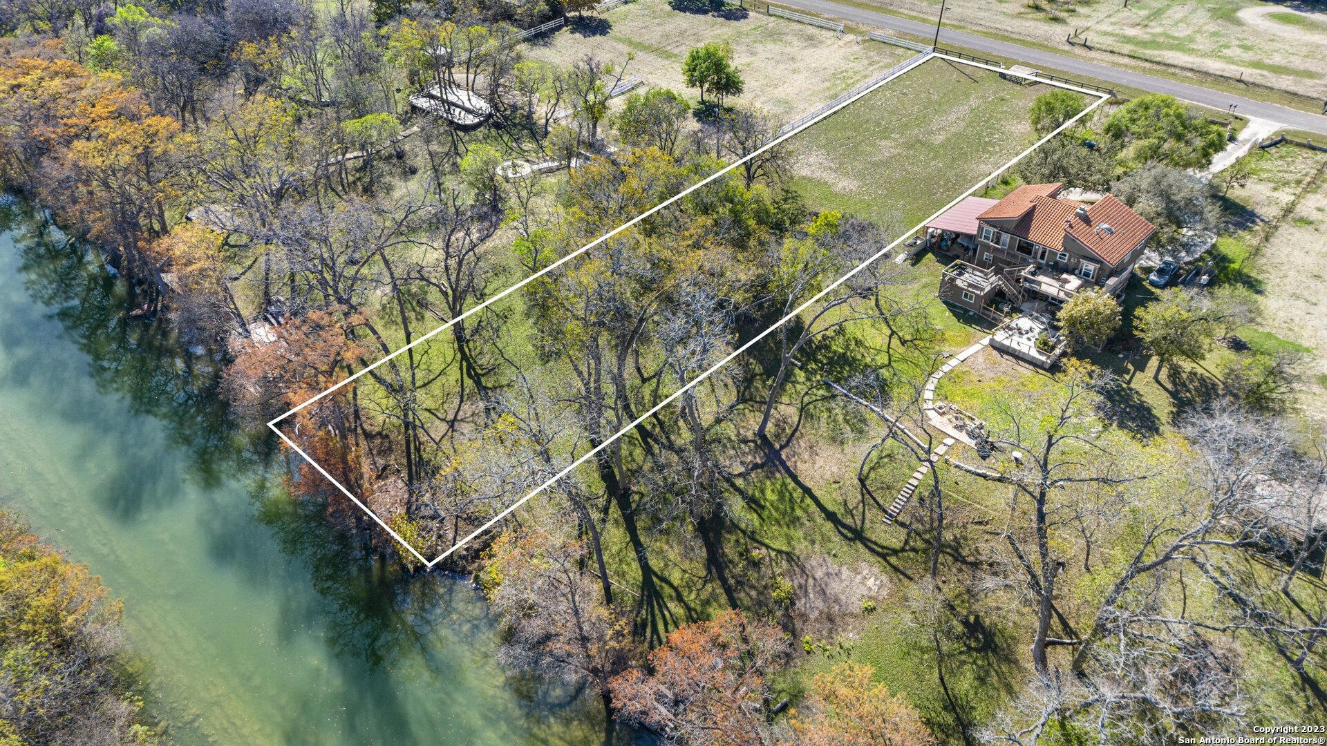 a backyard of a house with lots of green space