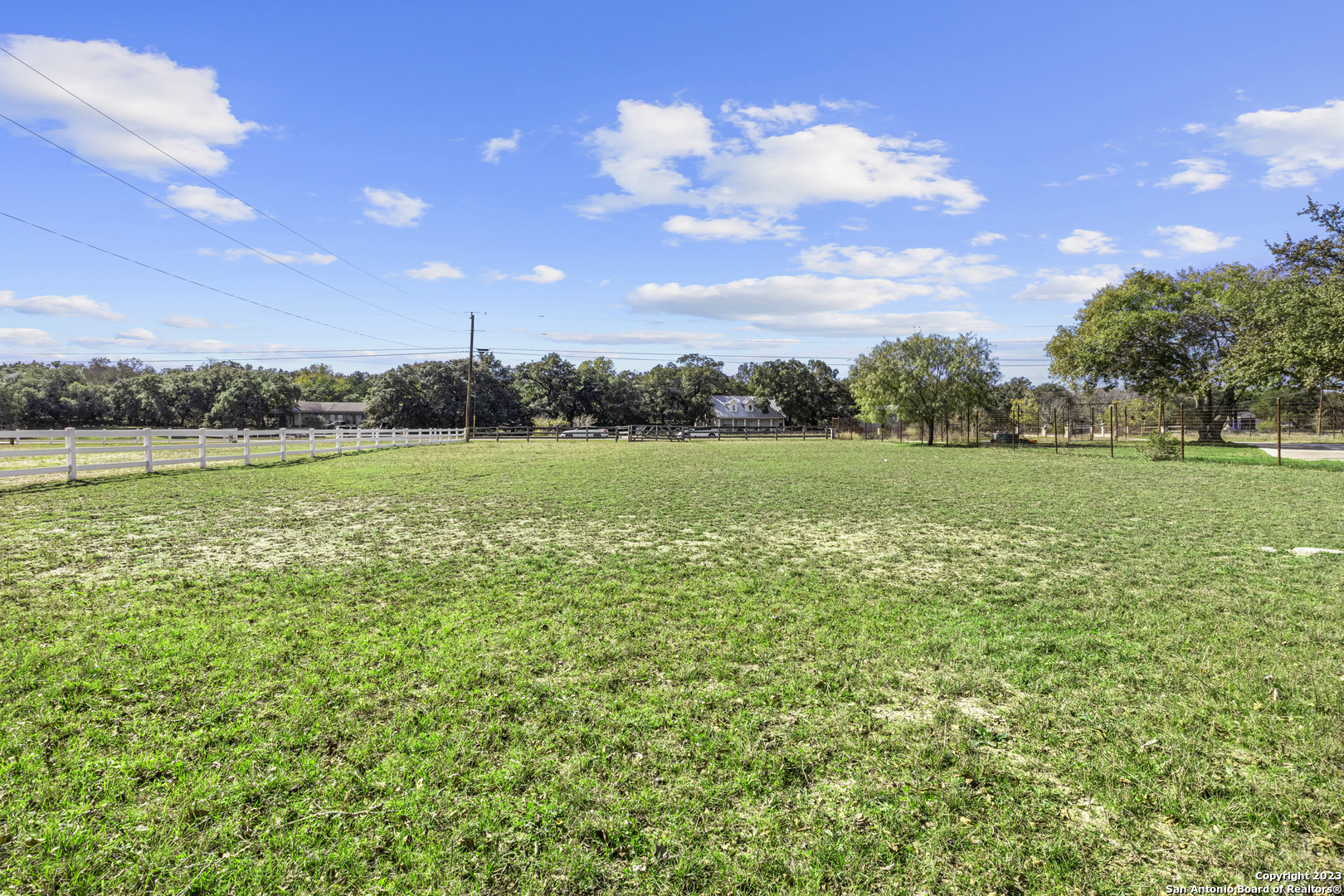 1236 Whispering Water Spring Branch, TX 78070 - Photo 10 of 22 a view of a green field with an trees in the background