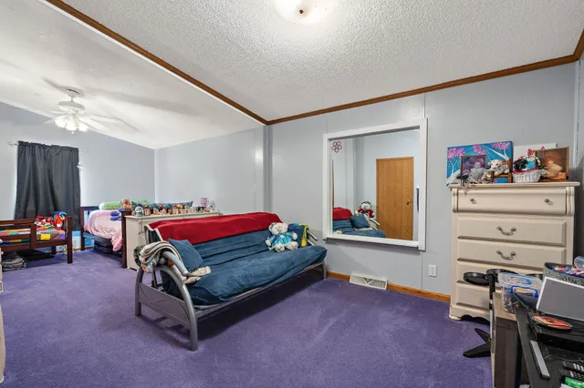 a bedroom with furniture and a bed