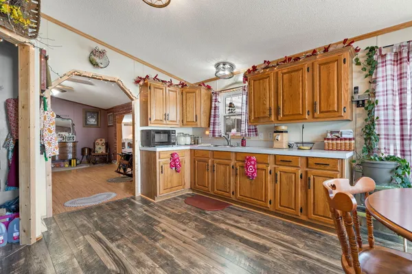 a kitchen with stainless steel appliances granite countertop a sink and cabinets