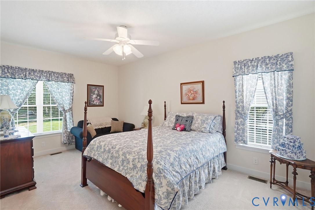 3600 Market Road Mechanicsville, VA 23111 - Photo 38 of 67 a bedroom with a bed and a chandelier