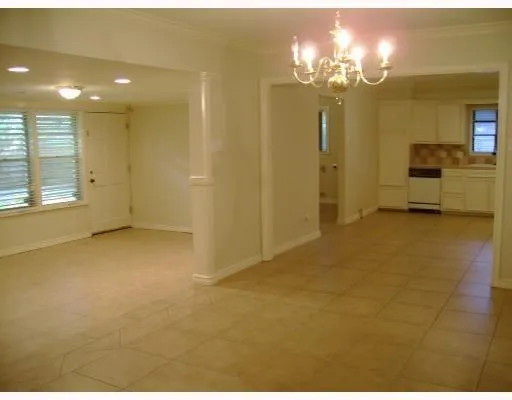 a view of a chandelier in a room and a bathroom