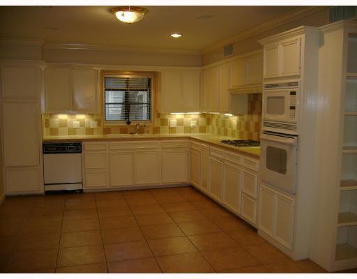 609 Peerman Place Corpus Christi, TX 78411 - Photo 5 of 10 a kitchen with stainless steel appliances a sink and cabinets