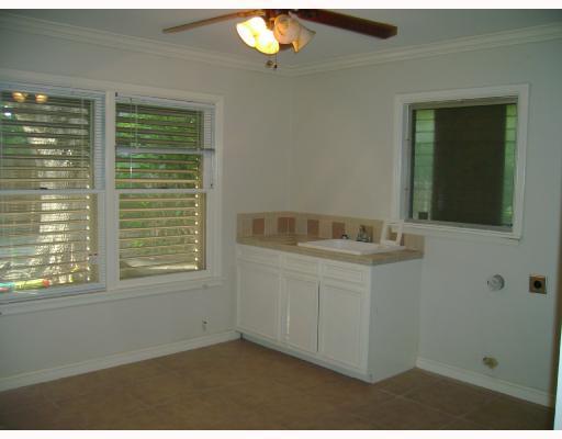 609 Peerman Place Corpus Christi, TX 78411 - Photo 8 of 10 a bathroom with a sink vanity and a mirror