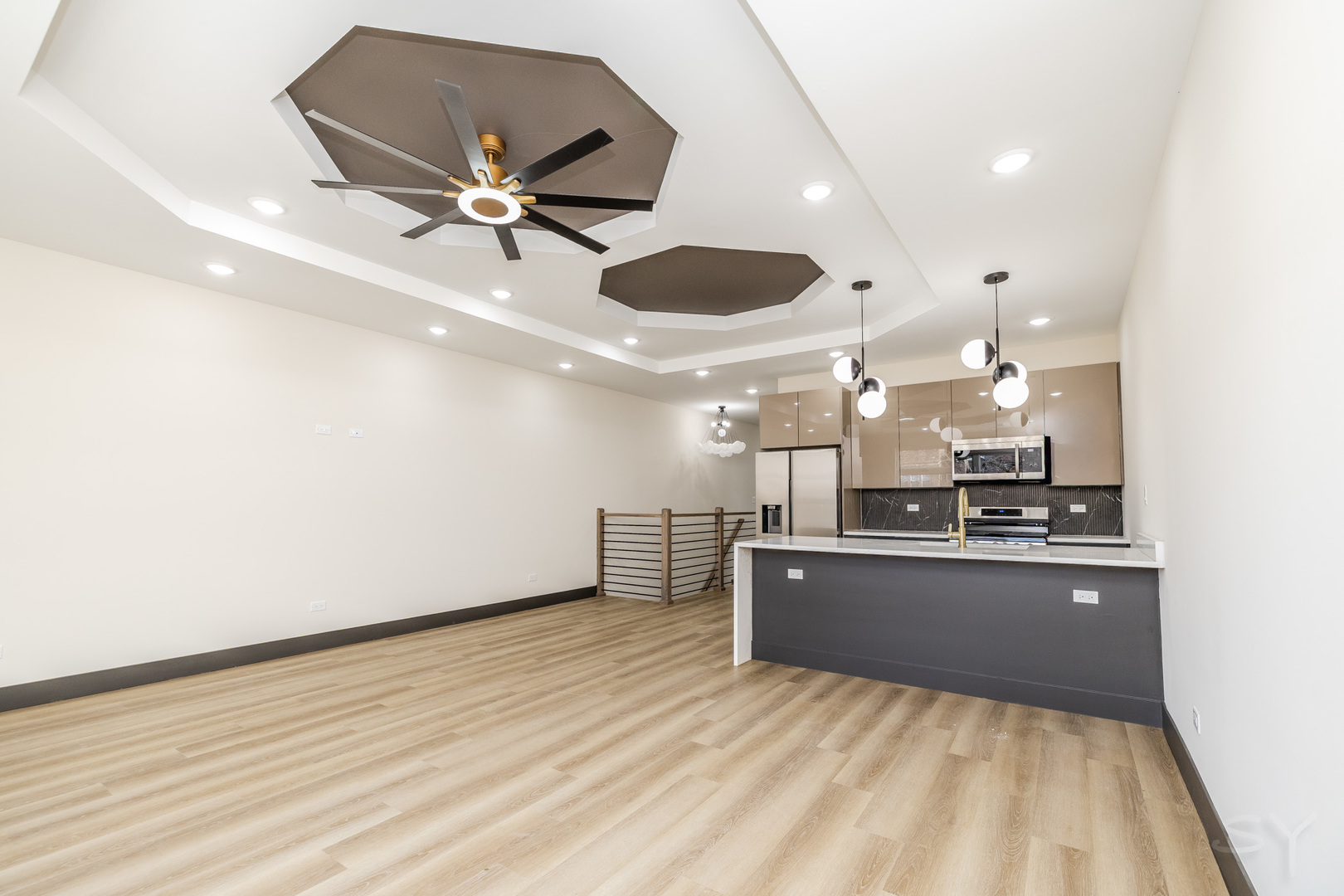 5637 South Prairie Avenue Chicago, IL 60637 - Photo 8 of 17 a kitchen with kitchen island a stove and a wooden floor