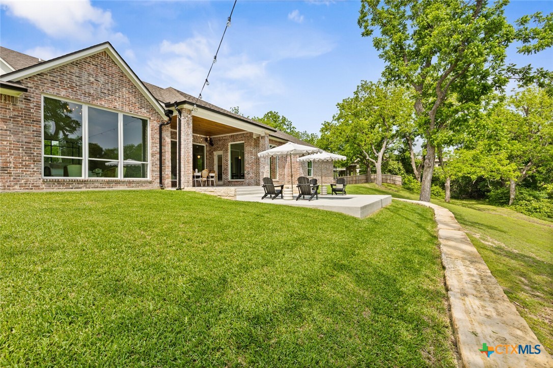 1007 Rivers Edge Drive Belton, TX 76513 - Photo 45 of 48 a front view of a house with a yard table and chairs