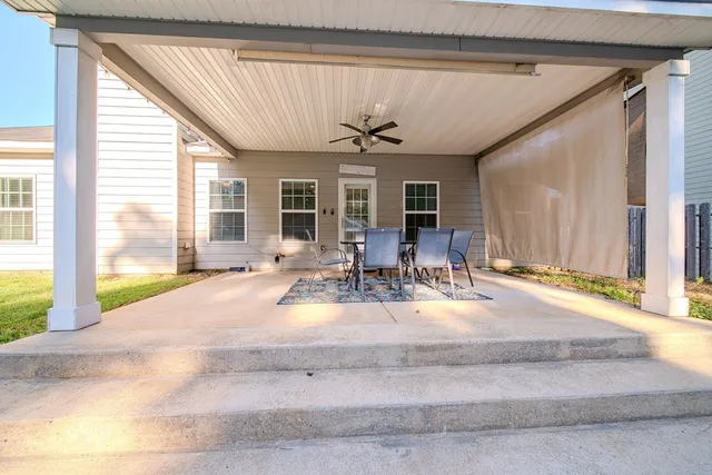 a view of a livingroom with furniture and window