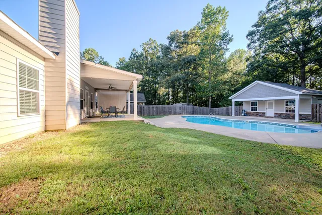 a front view of house with yard and seating area