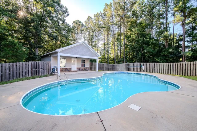 a view of a swimming pool with a patio