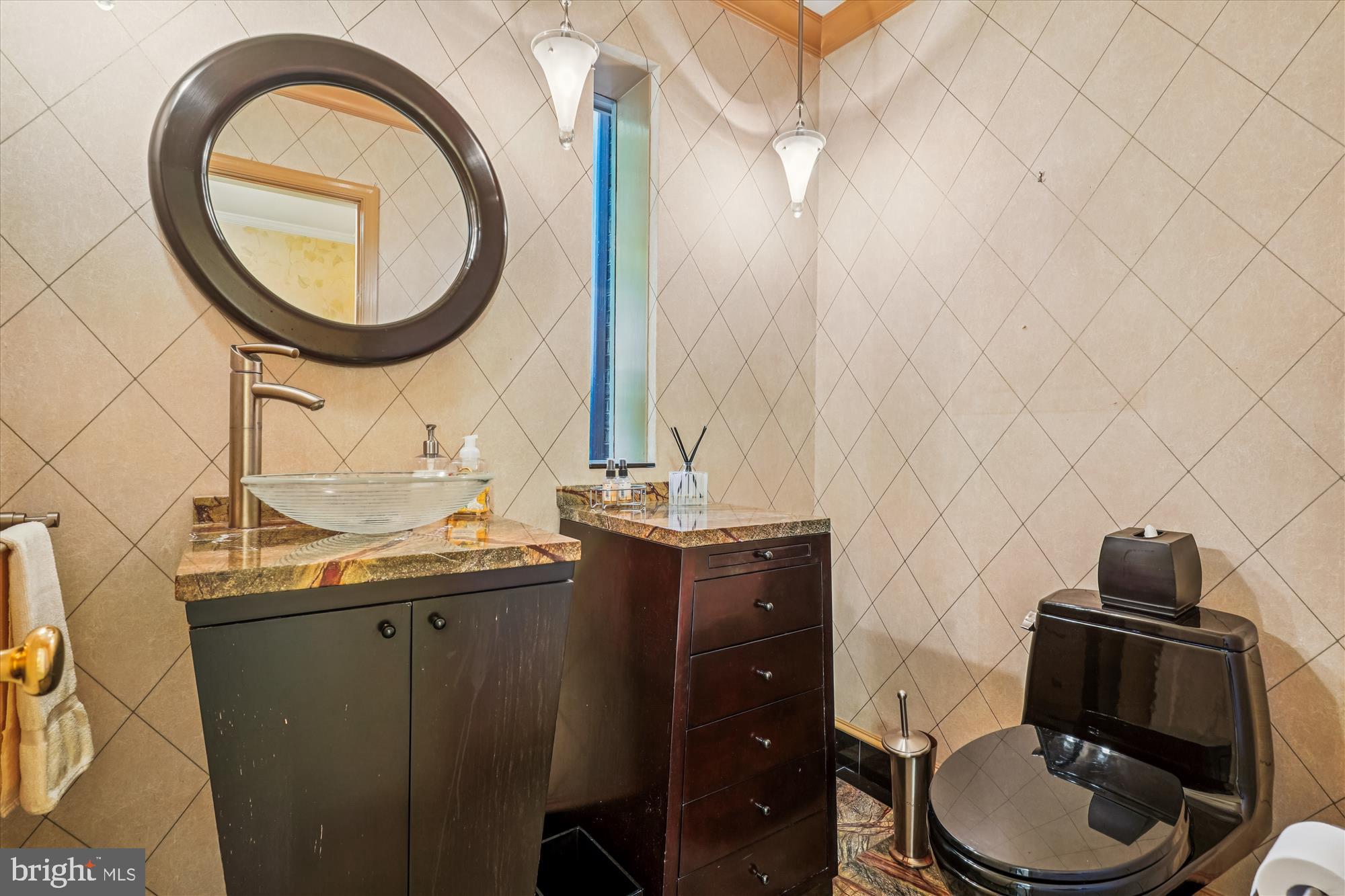 702 Belgrove Road McLean, VA 22101 - Photo 3 of 52 a bathroom with a sink and a mirror