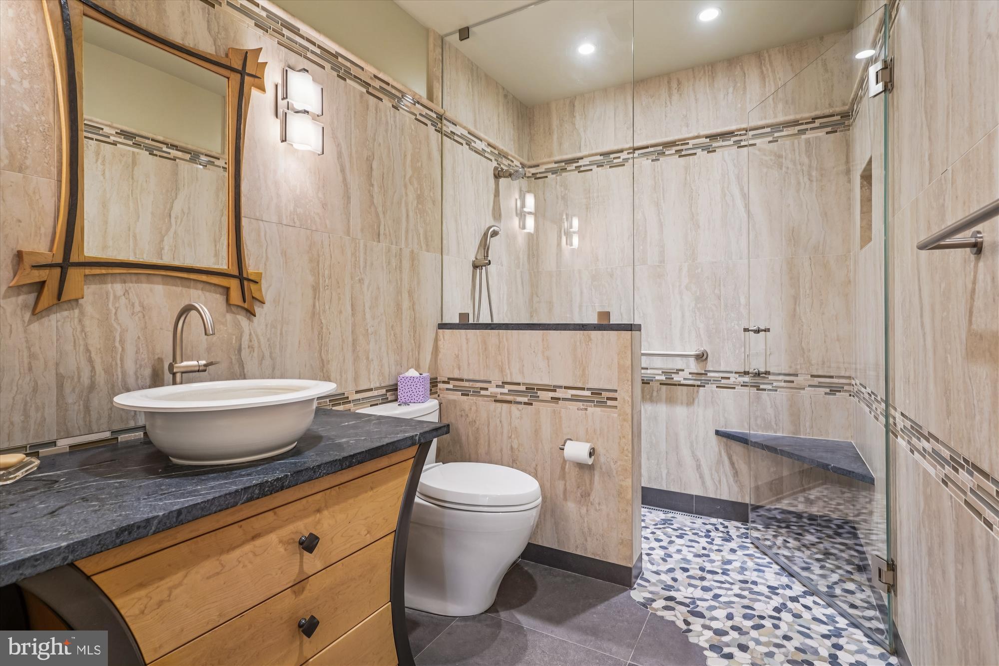 702 Belgrove Road McLean, VA 22101 - Photo 31 of 52 a bathroom with a granite countertop sink toilet a mirror and shower