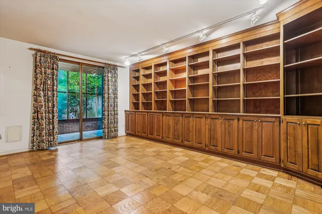 a view of an empty room with a sliding door