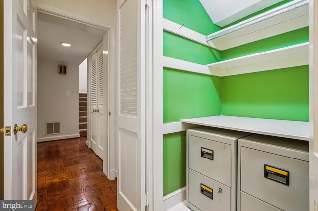a black white and white photo of a living room