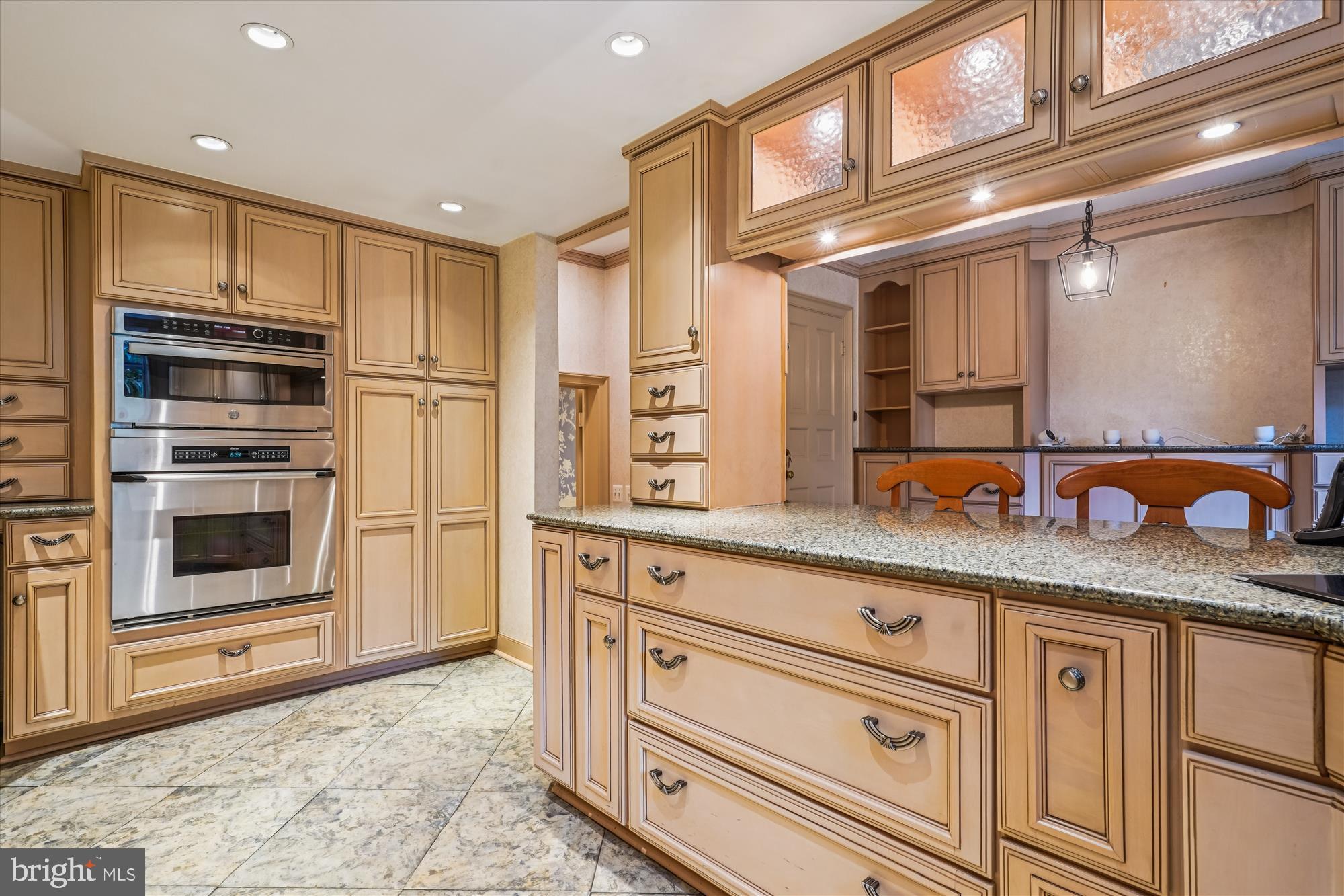 702 Belgrove Road McLean, VA 22101 - Photo 6 of 52 a kitchen with stainless steel appliances granite countertop a sink and cabinets