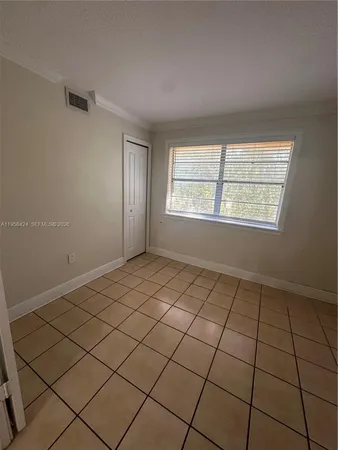 a view of an empty room and window