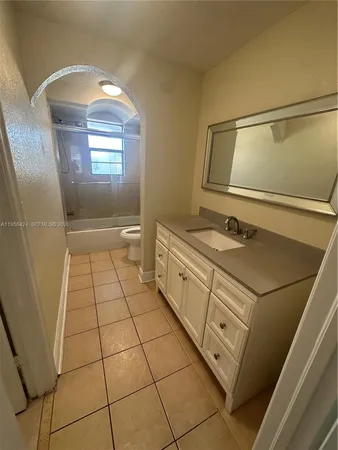 a bathroom with a sink a vanity and mirror