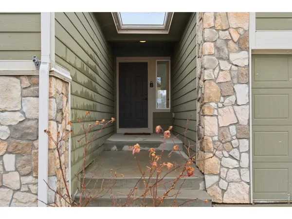 a view of entryway with a front door