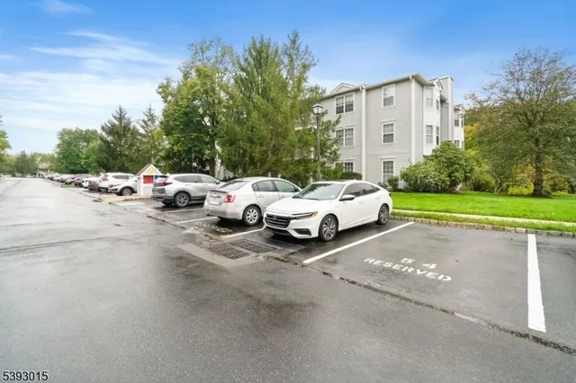 a group of cars parked in front of a house