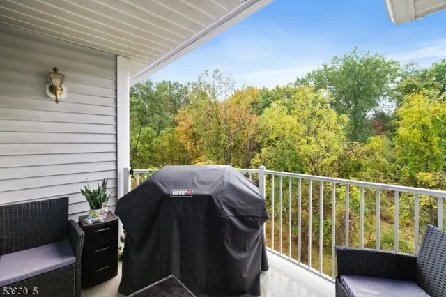 a view of a balcony with furniture