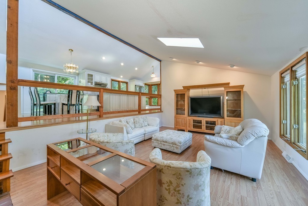 54 Drumlin Road Newton, MA 02459 - Photo 4 of 12 a living room with furniture and a flat screen tv