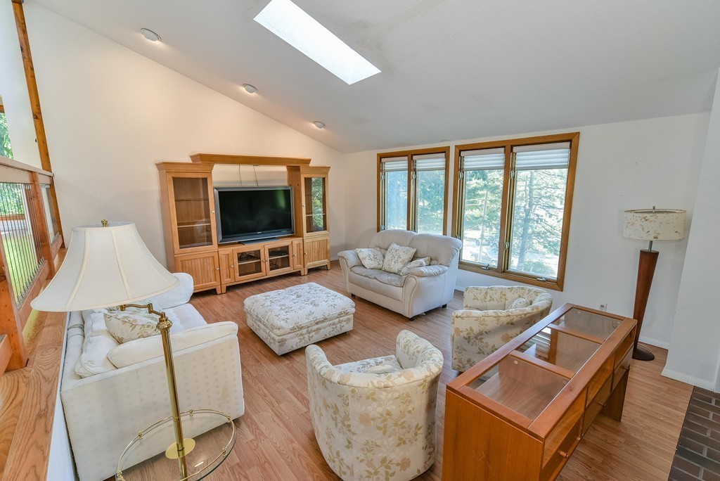 54 Drumlin Road Newton, MA 02459 - Photo 5 of 12 a living room with furniture flat screen tv and a large window