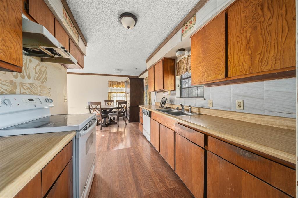 3692 Fm 66 Grandview, TX 76050 - Photo 11 of 39 a kitchen with wooden cabinets and sink