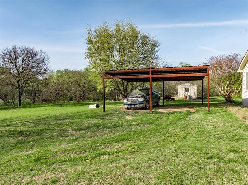 3692 Fm 66 Grandview, TX 76050 - Photo 17 of 39 a view of a house with backyard and a tree