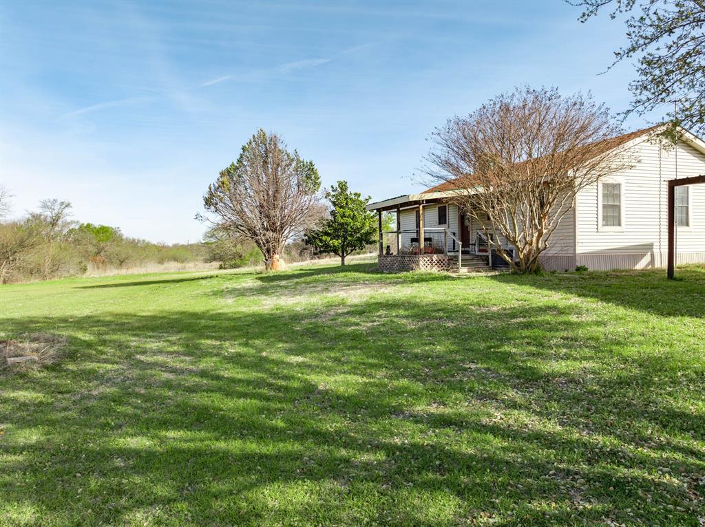 3692 Fm 66 Grandview, TX 76050 - Photo 20 of 39 a front view of a house with a yard