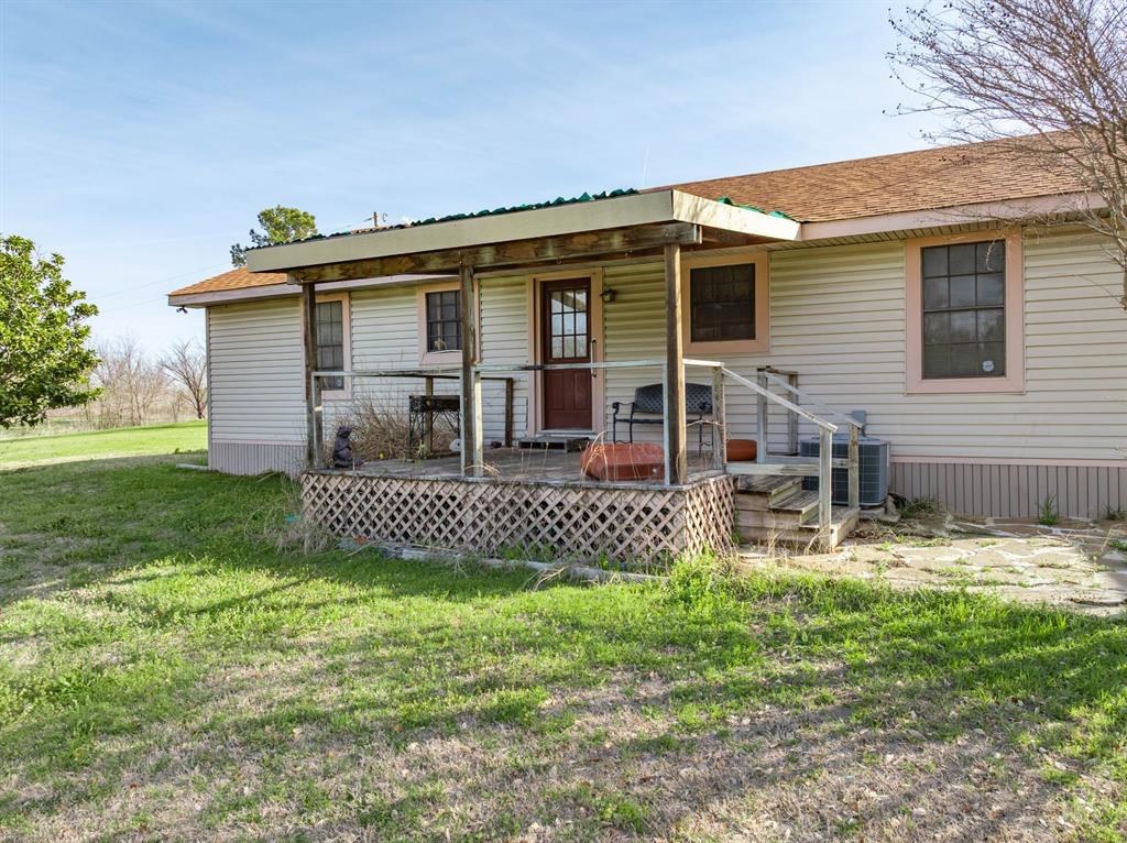 3692 Fm 66 Grandview, TX 76050 - Photo 21 of 39 front view of a house with a yard